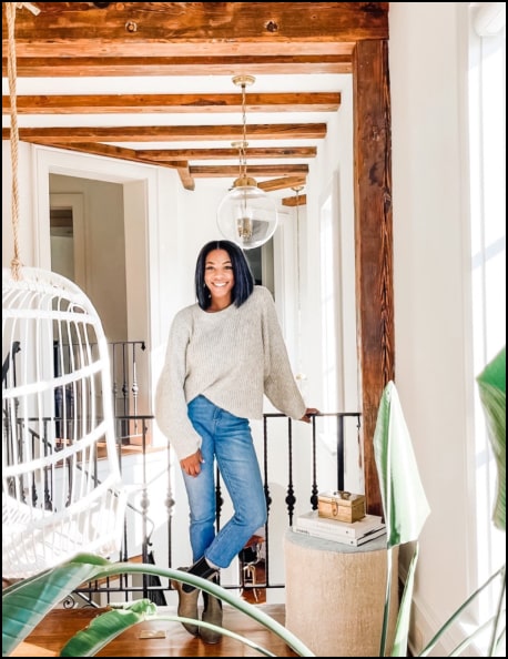 zoey belton standing in front of indoor balcony